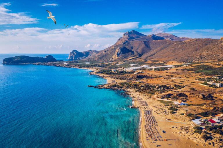 Aerial shot of beautiful turquoise beach Falasarna (Falassarna) in Crete, Greece. View of famous paradise sandy deep turquoise beach of Falasarna (Falassarna) in North West, Crete island, Greece.